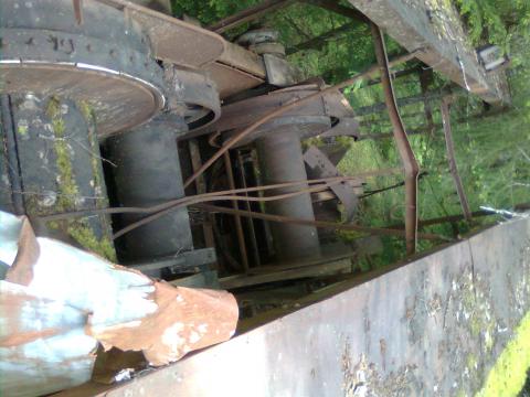 just massive.  50 ft long 16 ft wide. top is laying on the ground beside it. another 8ft. didnt see the boom.12 solid steel rolling pin tube rollers. 